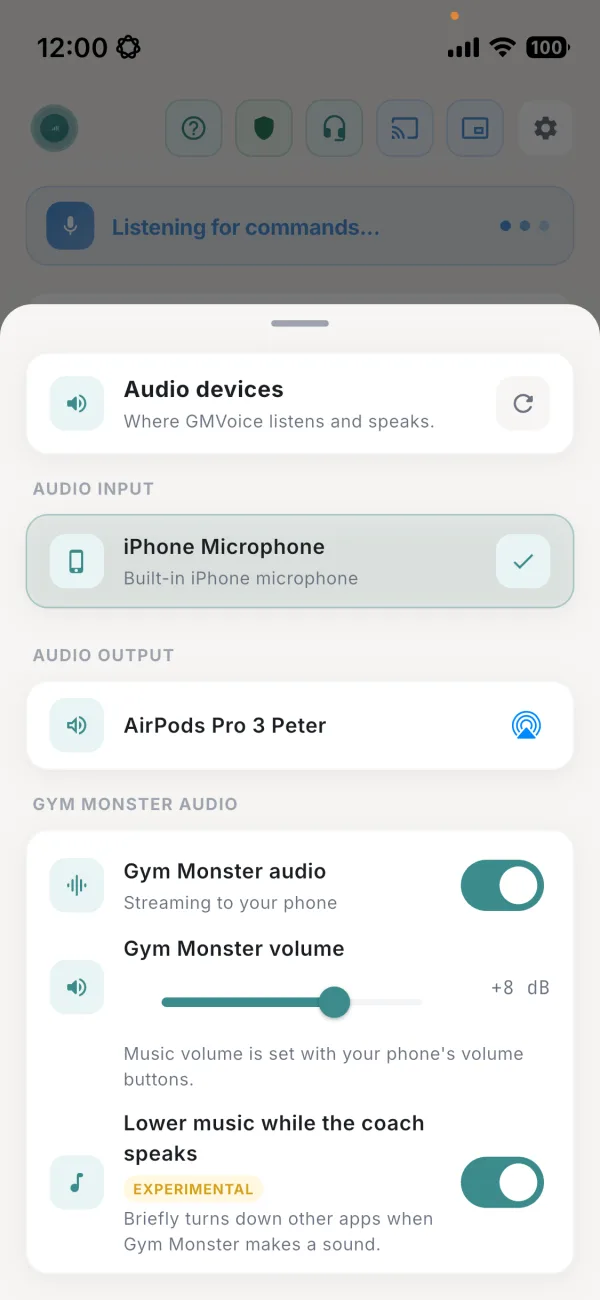 Panel Audio devices de GMVoice: iPhone Microphone como entrada, AirPods Pro 3 como salida, Gym Monster audio activado y transmitiendo al teléfono, Gym Monster volume a +8 dB y Lower music while the coach speaks activado.